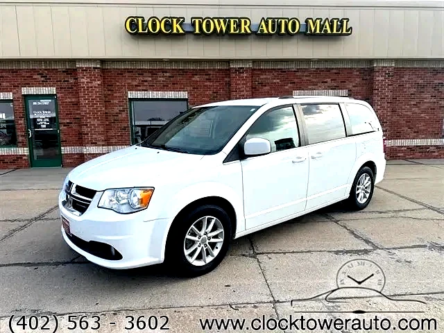 2018 Dodge Caravan  Caravan in front of Clock Tower Mall Used car business