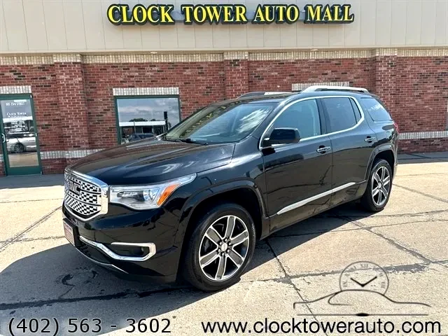2019 GMC Acadia  Acadia in front of Clock Tower Mall Used car business