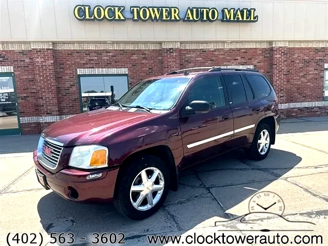 2007 GMC Envoy  Envoy in front of Clock Tower Mall Used car business