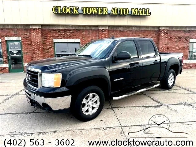 2011 GMC Sierra  Sierra in front of Clock Tower Mall Used car business