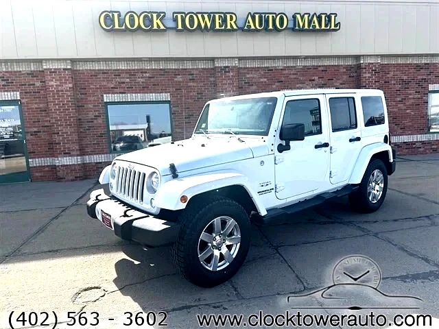 2016 Jeep Wrangler  Wrangler in front of Clock Tower Mall Used car business