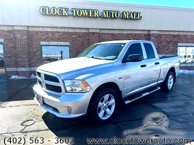 2014 RAM 1500  1500 in front of Clock Tower Mall Used car business